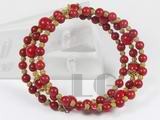 5mm and 8mm red coral stretchy bracelet with golden ball